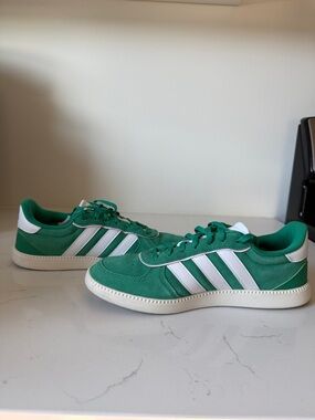 Women’s size 10 Adidas Green Suede Samba-Style Sneakers with White Stripes.